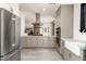 Spacious kitchen with stainless steel appliances, granite countertops, and light-colored cabinets at 4901 E Amelia Ave, Phoenix, AZ 85018