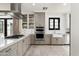 Modern kitchen with granite countertops, stainless steel appliances, and custom cabinetry at 4901 E Amelia Ave, Phoenix, AZ 85018