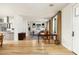 Spacious open-concept living area with hardwood floors connecting living, dining, and kitchen spaces at 4901 E Amelia Ave, Phoenix, AZ 85018