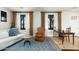 Bright living room with stylish decor, hardwood floors, and ample natural light at 4901 E Amelia Ave, Phoenix, AZ 85018