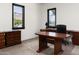 Office with carpet, traditional wood furniture, and dual windows providing plenty of light at 4901 E Amelia Ave, Phoenix, AZ 85018