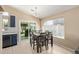 Bright dining area features wood-look floors, backyard access and an abundance of natural light at 5018 W Wikieup Ln, Glendale, AZ 85308