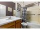 Traditional bathroom with decorative wall art and a shower-tub combo at 5102 S Peachwood Dr, Gilbert, AZ 85298