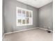 Comfortable bedroom with neutral carpet, shutters, and neutral color scheme at 5102 S Peachwood Dr, Gilbert, AZ 85298
