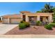 Charming single-story home with a well-maintained landscape and a spacious three-car garage at 5102 S Peachwood Dr, Gilbert, AZ 85298