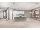 Open kitchen with white cabinets, an island, and tile flooring next to the dining area at 5102 S Peachwood Dr, Gilbert, AZ 85298