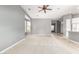 Open living room featuring neutral walls, carpet, and natural light from the bay window at 5102 S Peachwood Dr, Gilbert, AZ 85298