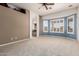 Spacious main bedroom with large windows and a neutral color scheme at 5102 S Peachwood Dr, Gilbert, AZ 85298