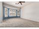 Large main bedroom featuring big bright windows and neutral carpeting at 5102 S Peachwood Dr, Gilbert, AZ 85298