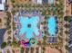 Aerial view of a resort-style community pool featuring a splash pad, water slides, and ample deck space at 5637 S Parrish --, Mesa, AZ 85212