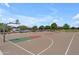 Community basketball court with well-maintained surfaces and hoops, offering a recreational space for residents at 5637 S Parrish --, Mesa, AZ 85212