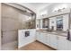 Modern bathroom featuring a walk-in shower, double sinks, and ample storage at 5637 S Parrish --, Mesa, AZ 85212