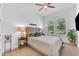 Cozy bedroom with natural light, neutral tones, and a ceiling fan at 5637 S Parrish --, Mesa, AZ 85212
