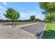 Outdoor bocce ball court surrounded by lush landscaping and sunny skies in a well-maintained community at 5637 S Parrish --, Mesa, AZ 85212