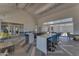 Well-lit common area with a modern counter, bar stools, and a spacious layout at 5637 S Parrish --, Mesa, AZ 85212