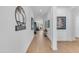 Entryway with a decor wall piece, leading to a bright and airy living space at 5637 S Parrish --, Mesa, AZ 85212