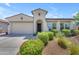 Beautiful front exterior showcases a charming home with a well-manicured, landscaped yard at 5637 S Parrish --, Mesa, AZ 85212