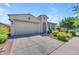 Charming home features a well-kept yard and attached two-car garage, with a nice driveway at 5637 S Parrish --, Mesa, AZ 85212