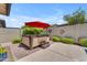 Backyard hot tub area with privacy fence and desert landscaping, perfect for outdoor relaxation at 5637 S Parrish --, Mesa, AZ 85212