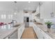 Bright kitchen boasts white cabinets, stainless steel appliances, and granite countertops at 5637 S Parrish --, Mesa, AZ 85212