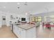 Open concept kitchen with an island flowing into the living and dining areas at 5637 S Parrish --, Mesa, AZ 85212
