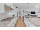 A kitchen featuring white cabinets, granite countertops, stainless appliances, and wooden floors at 5637 S Parrish --, Mesa, AZ 85212