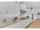 A kitchen featuring white cabinets, granite countertops, stainless appliances, and wooden floors at 5637 S Parrish --, Mesa, AZ 85212