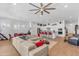 Open concept living room, kitchen, and dining area with an oversize sectional at 5637 S Parrish --, Mesa, AZ 85212