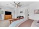 Bright main bedroom featuring a ceiling fan, carpet flooring, and ample natural light at 5637 S Parrish --, Mesa, AZ 85212
