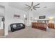 Spacious main bedroom with a sitting area, ceiling fan, and carpet flooring at 5637 S Parrish --, Mesa, AZ 85212