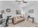 Bright office space with a comfortable sofa, desk, and natural light from the window at 5637 S Parrish --, Mesa, AZ 85212