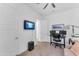Office area featuring a desk, office chair, and wall-mounted monitor for a focused workspace at 5637 S Parrish --, Mesa, AZ 85212