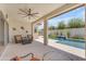 Covered patio featuring a ceiling fan, outdoor seating, and a view of the pool at 5637 S Parrish --, Mesa, AZ 85212