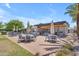 Outdoor picnic area featuring barbecue facilities, seating, and sun umbrellas for community residents at 5637 S Parrish --, Mesa, AZ 85212