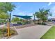 Community playground with modern equipment, shaded seating, and ample space for children to play at 5637 S Parrish --, Mesa, AZ 85212