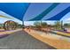 Bright community playground featuring modern equipment, soft ground cover, and sun shades at 5637 S Parrish --, Mesa, AZ 85212