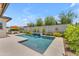 Serene pool area with a waterfall feature, surrounded by lush landscaping and a hot tub at 5637 S Parrish --, Mesa, AZ 85212