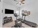 Bright workout room featuring a ceiling fan, treadmill, stationary bike, and weights at 5637 S Parrish --, Mesa, AZ 85212