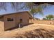 Large backyard featuring a fireplace and a covered patio area at 718 E Devon Dr, Gilbert, AZ 85296