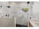Modern bathroom featuring a glass shower with hexagon tile and a window at 718 E Devon Dr, Gilbert, AZ 85296