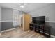 Relaxing bedroom featuring a sauna, TV, and a large window at 718 E Devon Dr, Gilbert, AZ 85296
