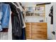 Organized walk-in closet with custom shelving and drawers for ample storage at 718 E Devon Dr, Gilbert, AZ 85296