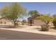 Charming single-story home with well-maintained landscaping and a spacious driveway at 718 E Devon Dr, Gilbert, AZ 85296