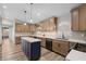 Gourmet kitchen with sleek countertops, custom cabinetry, and stainless steel appliances at 718 E Devon Dr, Gilbert, AZ 85296