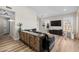A modern living room with stylish console, hardwood floors, and bright natural lighting at 718 E Devon Dr, Gilbert, AZ 85296