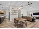 The living space boasts an open floor plan with lots of natural light and wood flooring at 718 E Devon Dr, Gilbert, AZ 85296