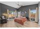 Spacious main bedroom with wood floors, vaulted ceilings and light-filled windows at 718 E Devon Dr, Gilbert, AZ 85296
