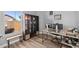 Bright home office with a large window, desk, and shelving unit for storage at 718 E Devon Dr, Gilbert, AZ 85296