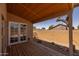 Covered patio with a wooden deck and views of the backyard at 718 E Devon Dr, Gilbert, AZ 85296