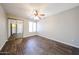 Bedroom with a ceiling fan, a window for natural light, and a mirrored closet door at 747 S Extension Rd # 115, Mesa, AZ 85210
